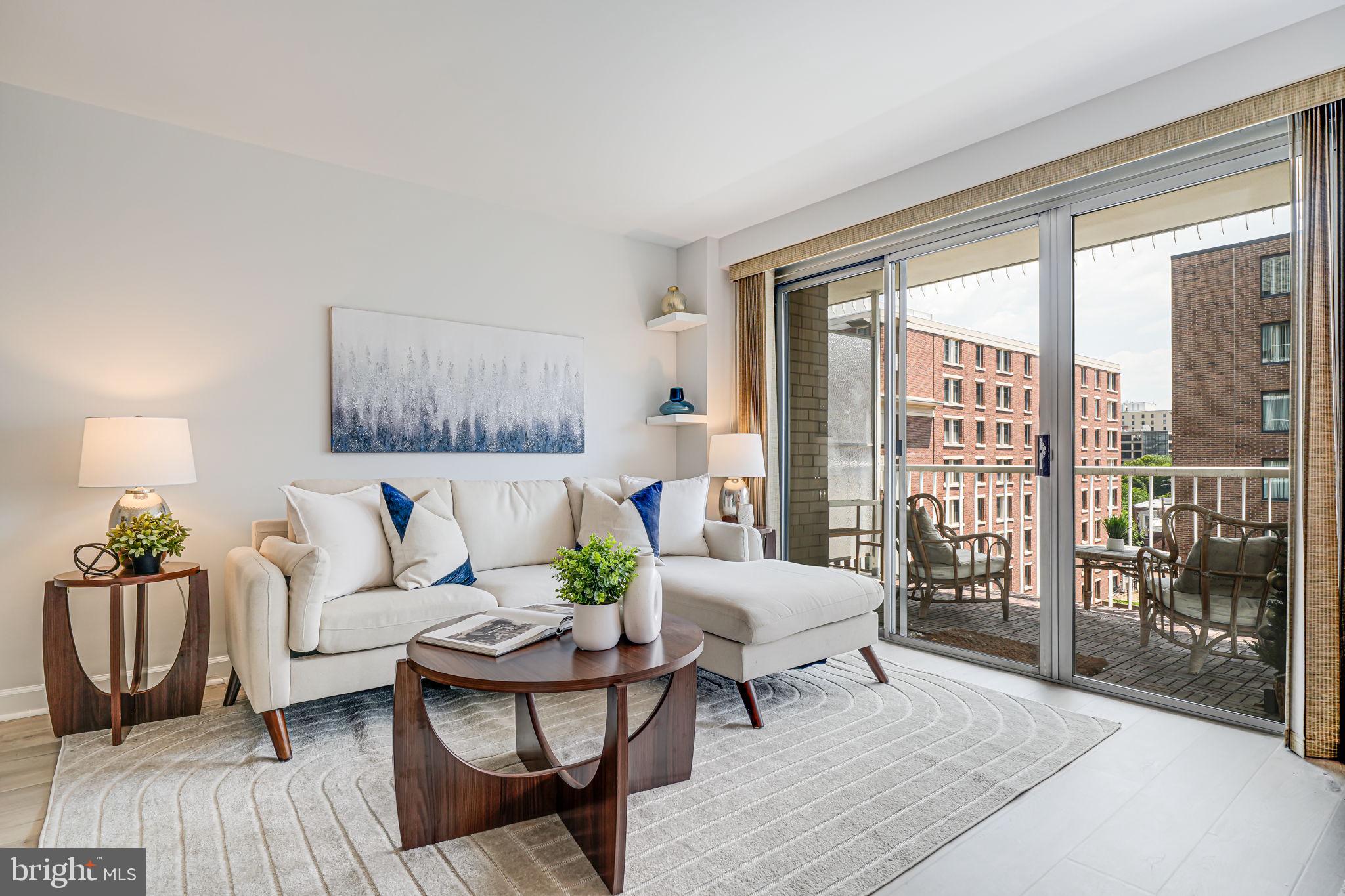 730 24th Street Northwest, Unit 612 Washington, DC 20037 - Photo 5 of 39 a living room with furniture and a large window