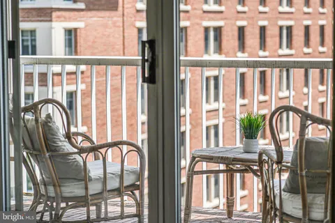a view of a balcony door and furniture