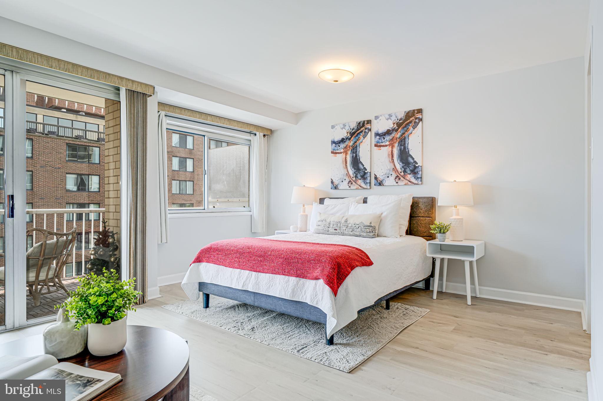 730 24th Street Northwest, Unit 612 Washington, DC 20037 - Photo 10 of 39 a spacious bedroom with a bed and a potted plant