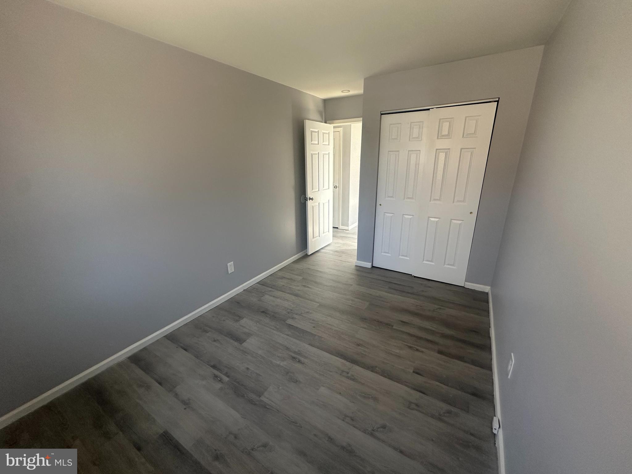 18-20 Thomas Road, Unit 18 Aston, PA 19014 - Photo 12 of 12 a view of an empty room with wooden floor