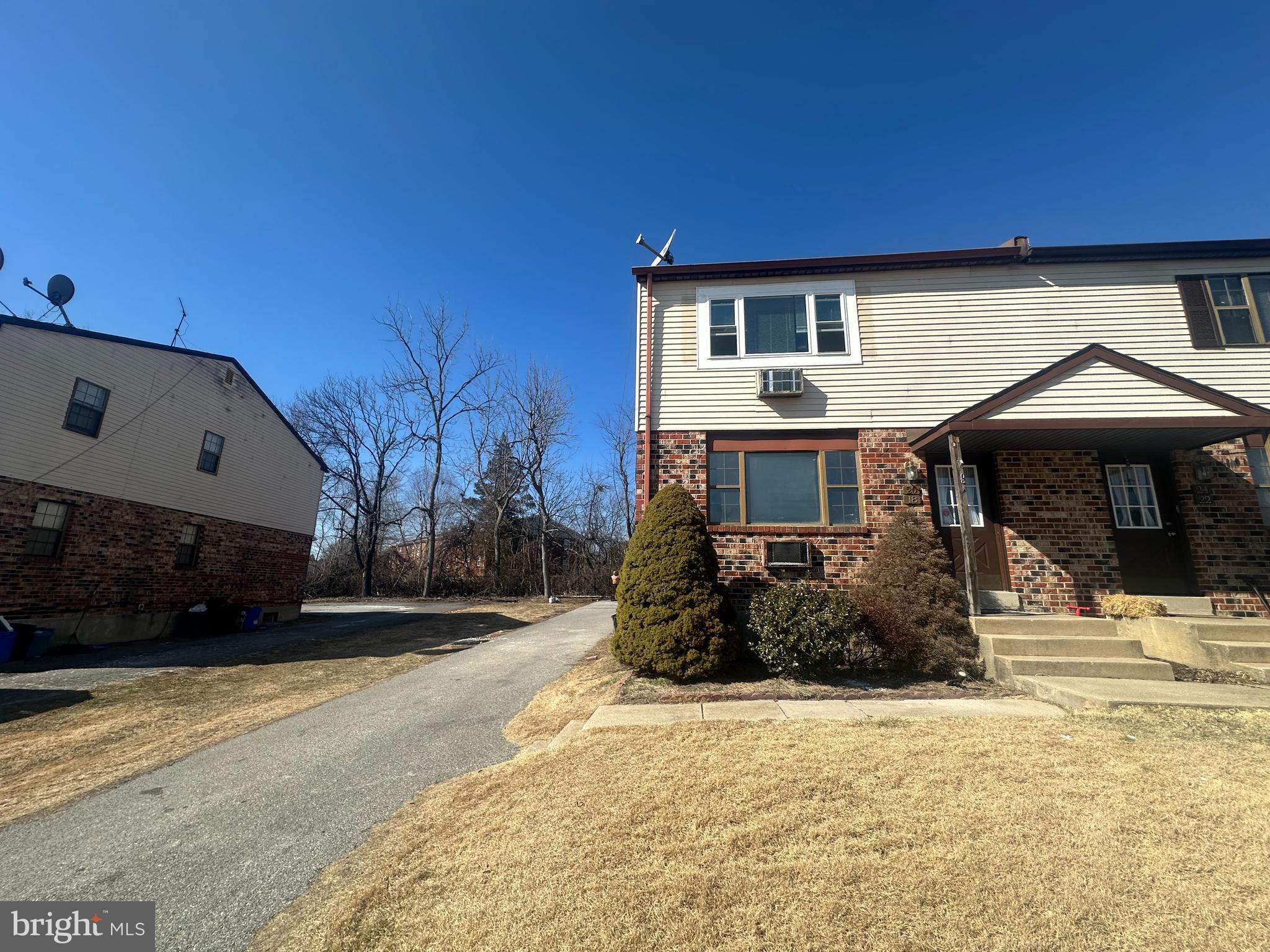 18-20 Thomas Road, Unit 18 Aston, PA 19014 - Photo 2 of 12 a front view of a house with a yard