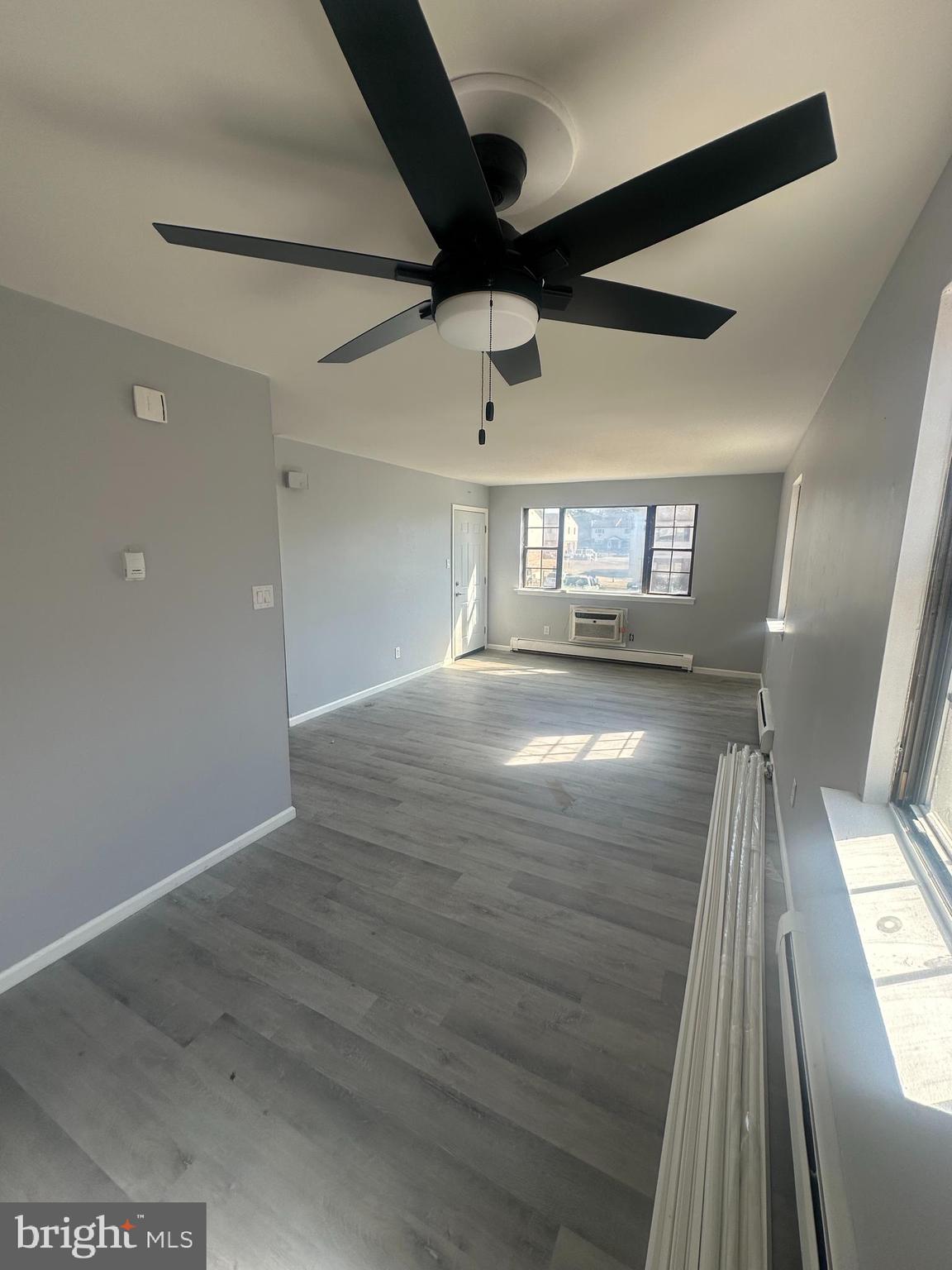 18-20 Thomas Road, Unit 18 Aston, PA 19014 - Photo 4 of 12 a view of empty room with wooden floor