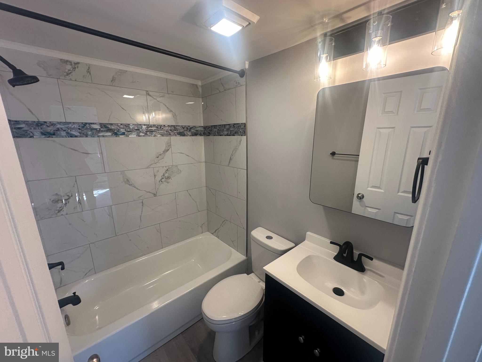 18-20 Thomas Road, Unit 18 Aston, PA 19014 - Photo 8 of 12 a bathroom with a sink toilet and shower