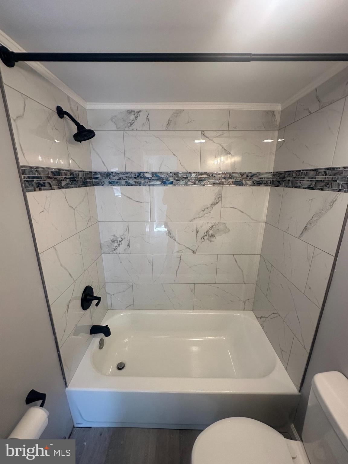 18-20 Thomas Road, Unit 18 Aston, PA 19014 - Photo 10 of 12 a bathroom with a bathtub and a shower