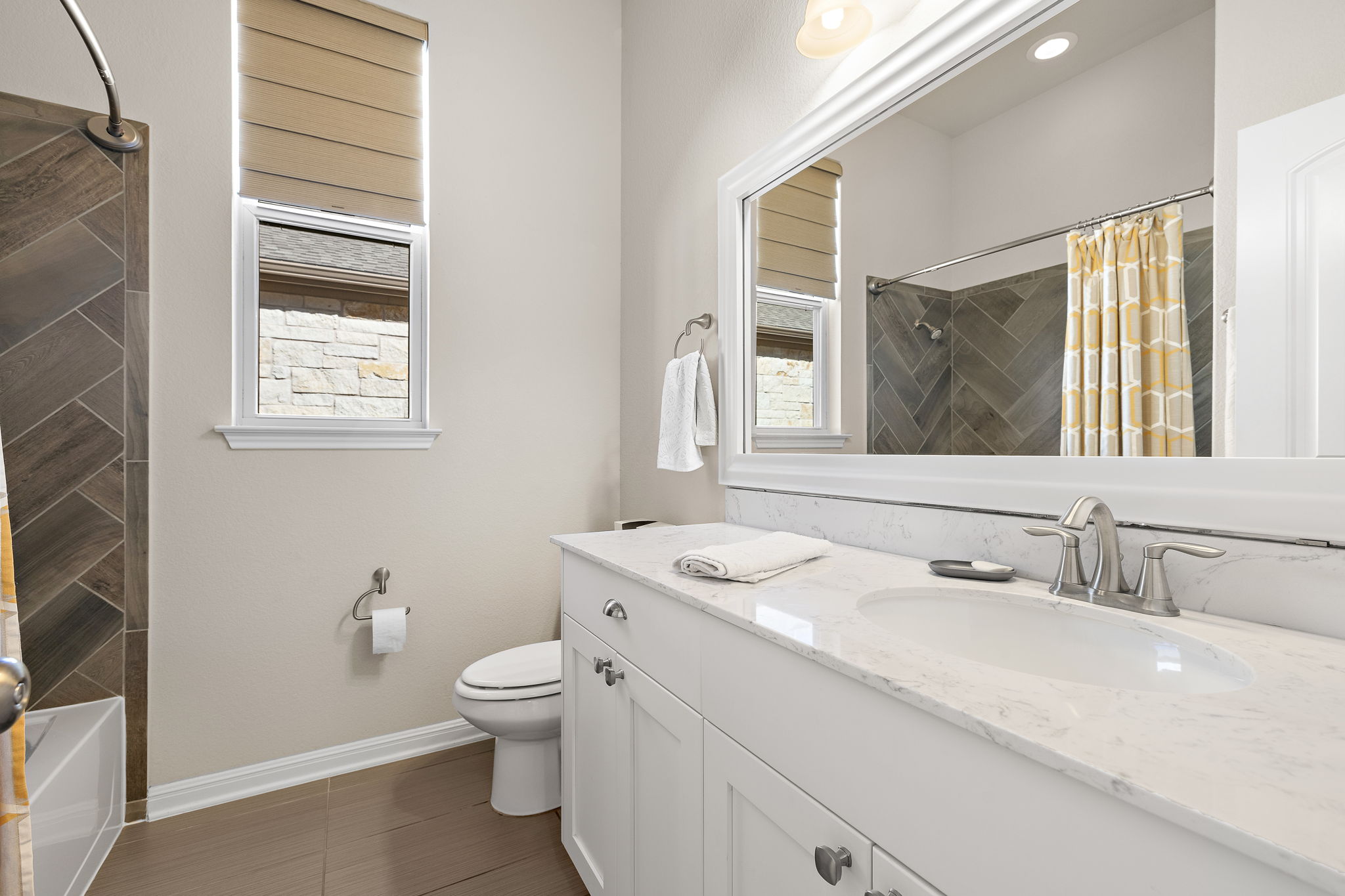 5016 Yucca Flower Lane Georgetown, TX 78626 - Photo 23 of 31 a bathroom with a granite countertop sink a toilet and a mirror
