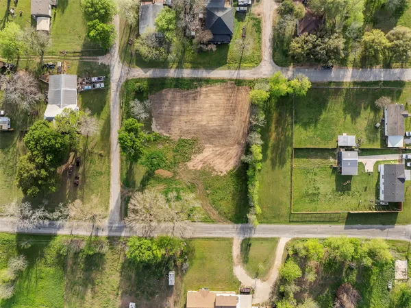 an aerial view of a houses with a lake view