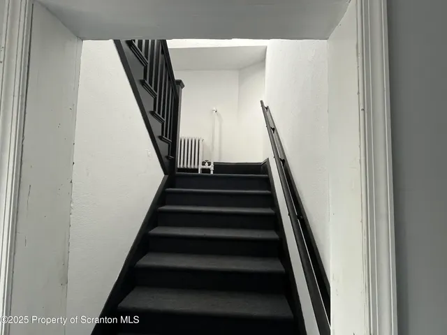 a bathroom with a sink a mirror and a bathtub