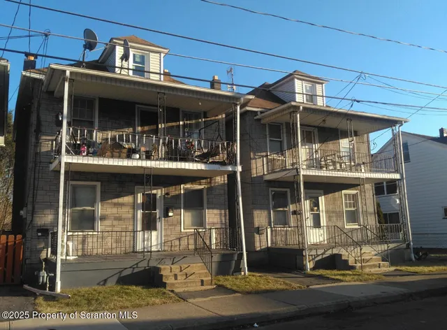 a kitchen with granite countertop a refrigerator and a stove