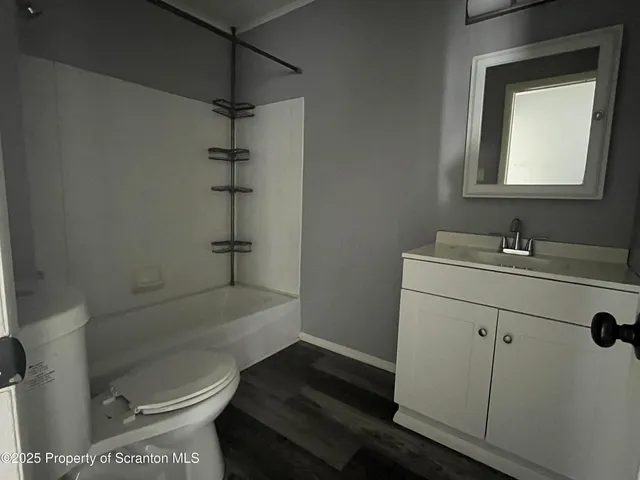 a kitchen with stainless steel appliances granite countertop a refrigerator and a stove