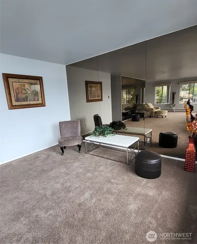 a bathroom with a toilet a sink a mirror and a shower