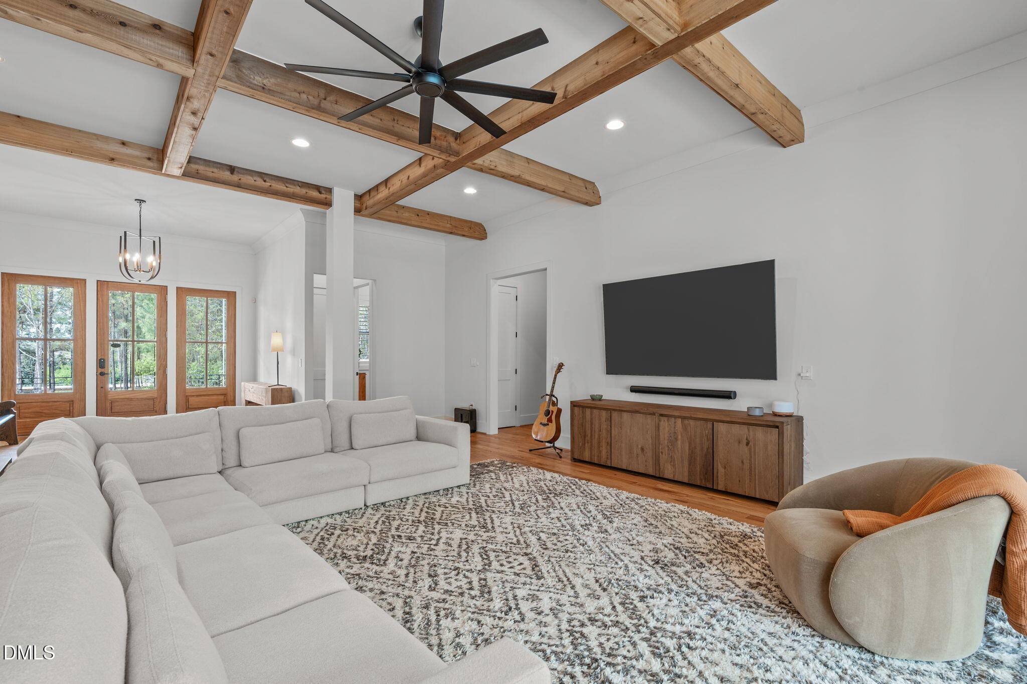 Sized to accommodate a variety of furniture styles and arrangements. Views to entry, powder room, and hall to primary suite.