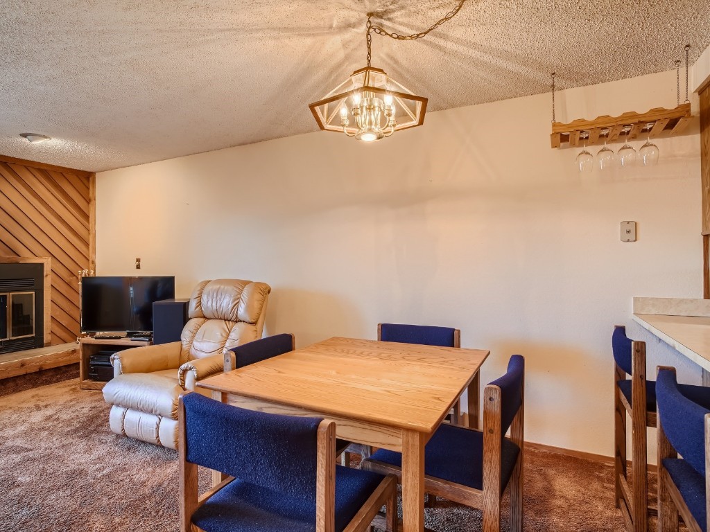 52 Club House Road, Unit 54 Breckenridge, CO 80424 - Photo 12 of 28 a view of a dining room with furniture