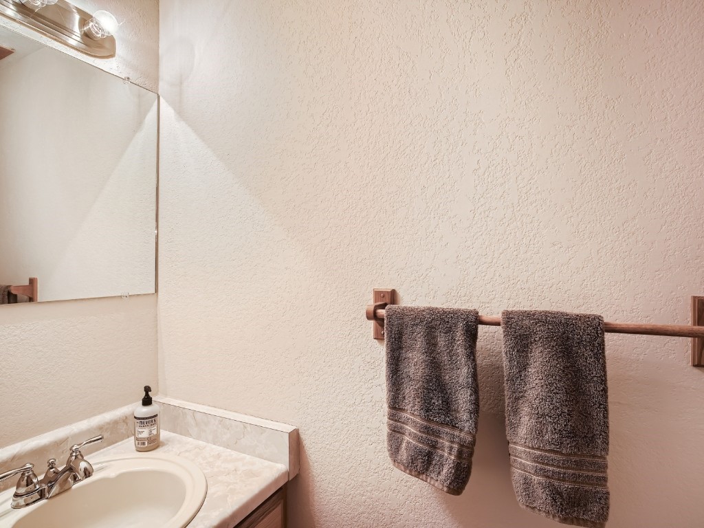 52 Club House Road, Unit 54 Breckenridge, CO 80424 - Photo 13 of 28 a bathroom with a granite countertop sink and a mirror
