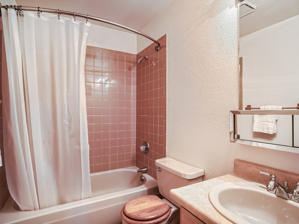 52 Club House Road, Unit 54 Breckenridge, CO 80424 - Photo 20 of 28 a bathroom with a toilet a sink and bathtub
