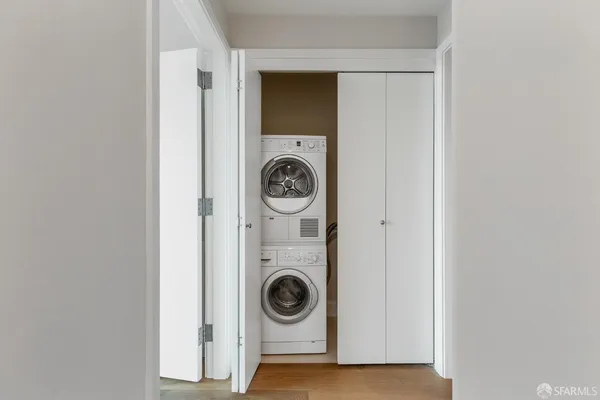 a view of a city with tall trees