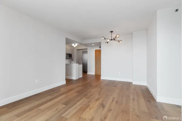 a kitchen with stainless steel appliances a refrigerator and a stove top oven