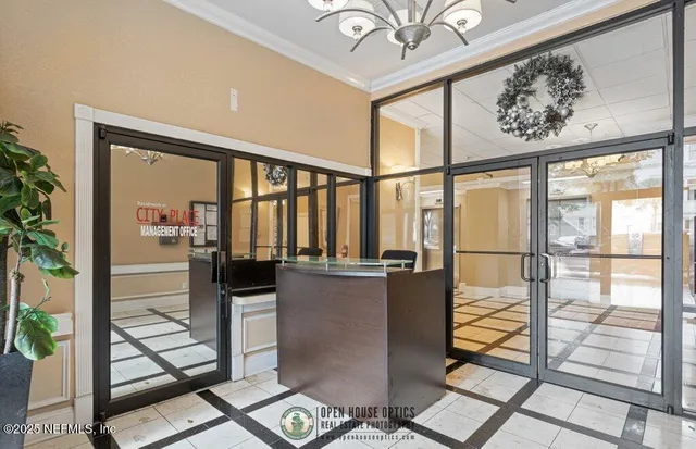 a view of a living room and chandelier
