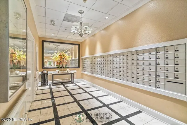 a room with pool table and windows