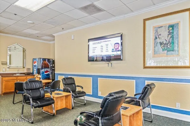 a large white kitchen with a large window