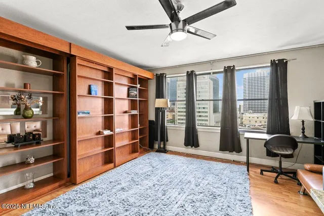 a view of workspace with furniture and window