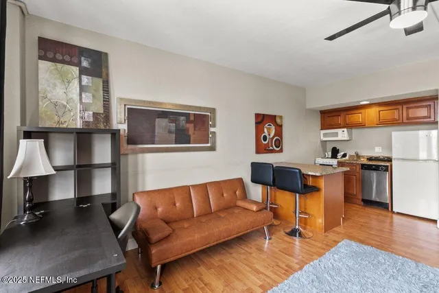 a living room with furniture and a window