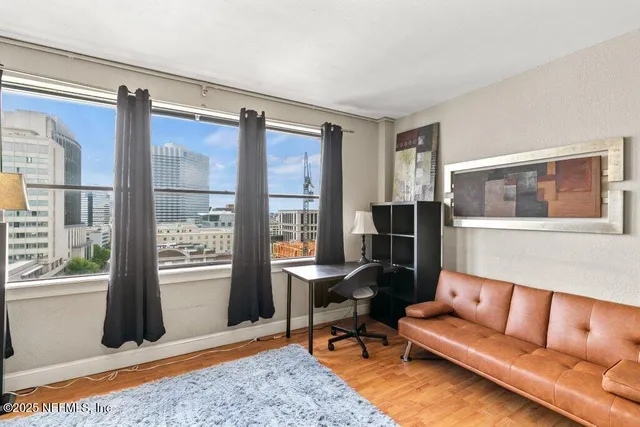a living room with furniture and a window