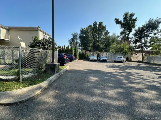 a view of a street with a building in the background