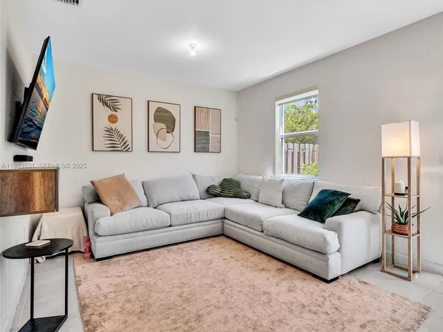 a kitchen with stainless steel appliances a refrigerator sink and microwave