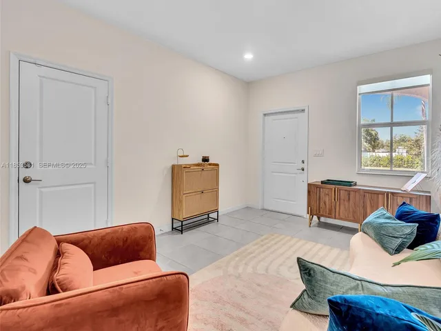 an aerial view of residential houses with outdoor space and river