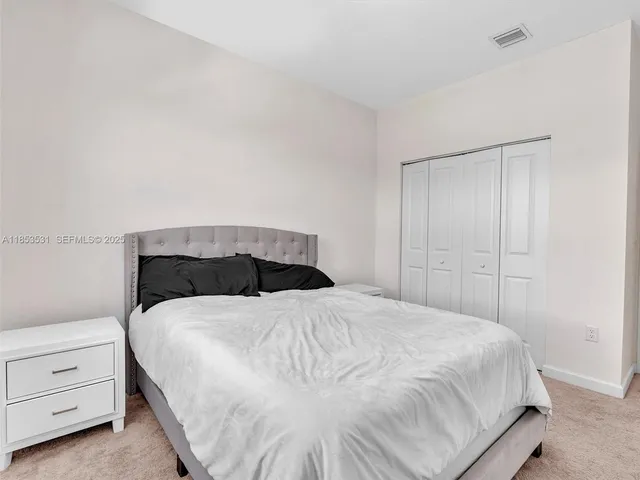 a view of a workspace with furniture and a chair