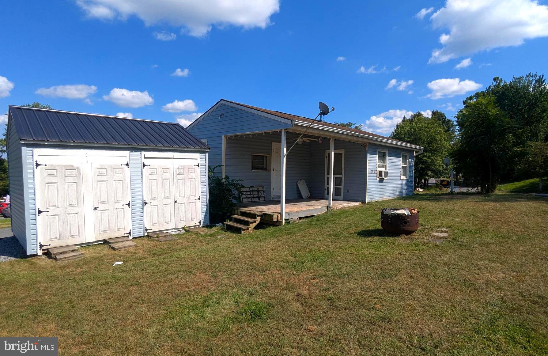 41 Ranger Road Falling Waters, WV 25419 - Photo 2 of 9 a view of a house with backyard porch and sitting area