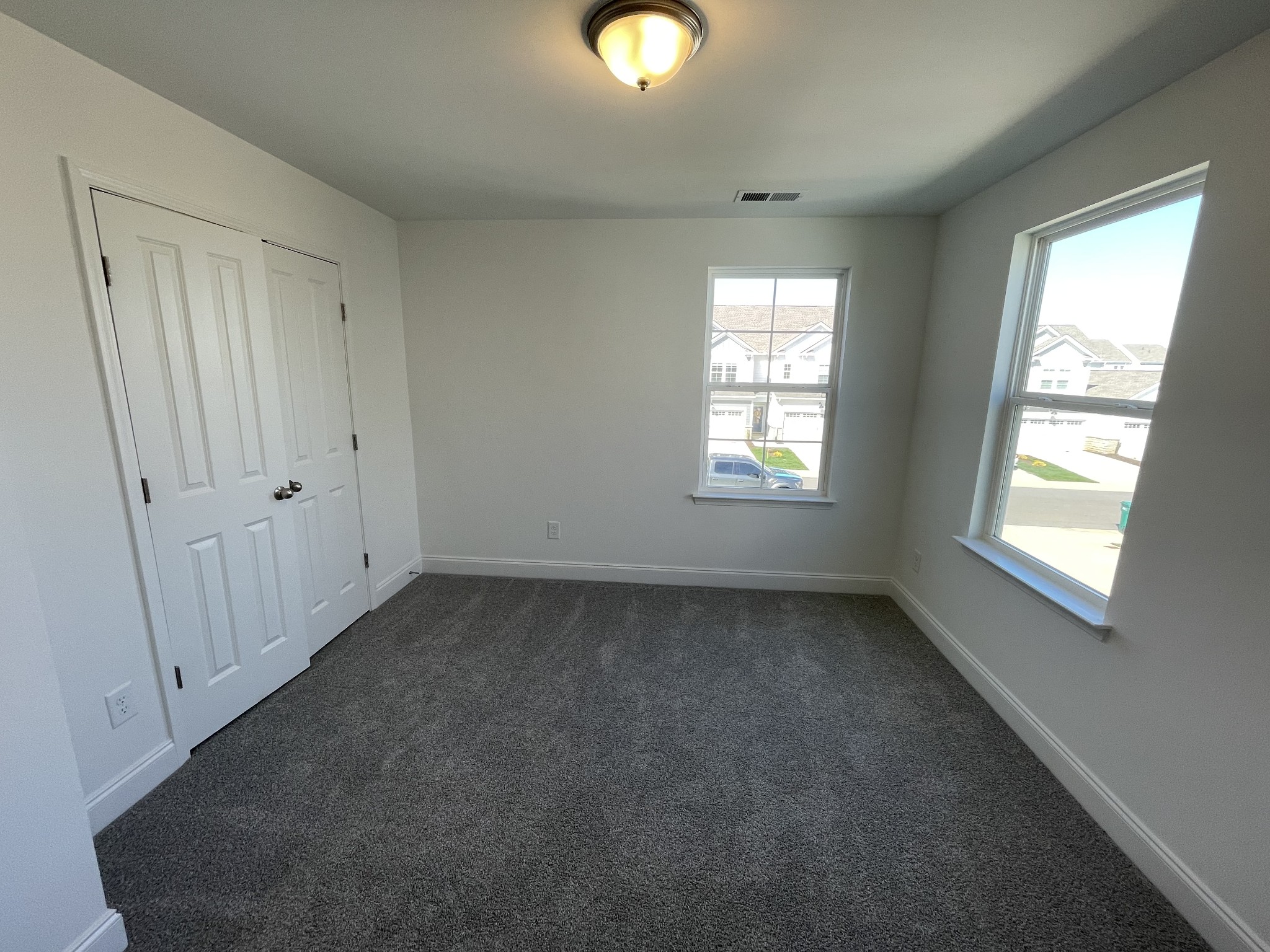 1156 June Wilde Ridge Spring Hill, TN 37174 - Photo 14 of 20 a view of an empty room with wooden floor and windows