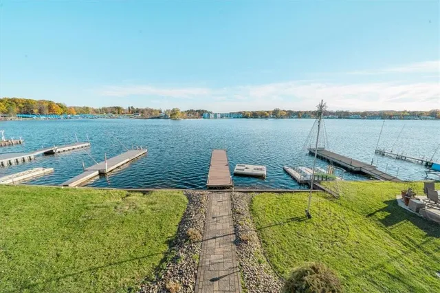 a view of a lake with a bench next to a lake