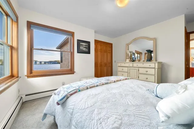 a bedroom with a bed and a cabinets