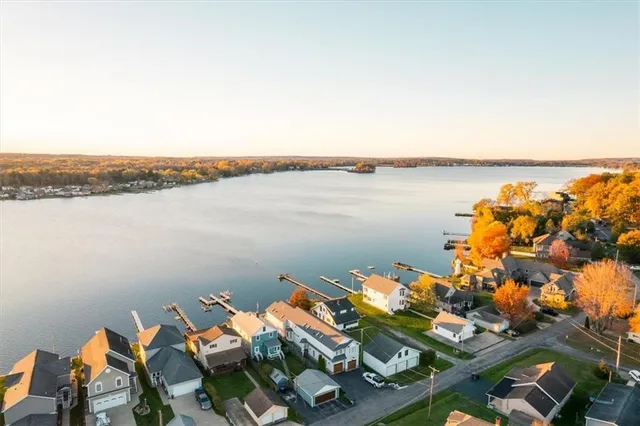 a view of a terrace with lawn chairs