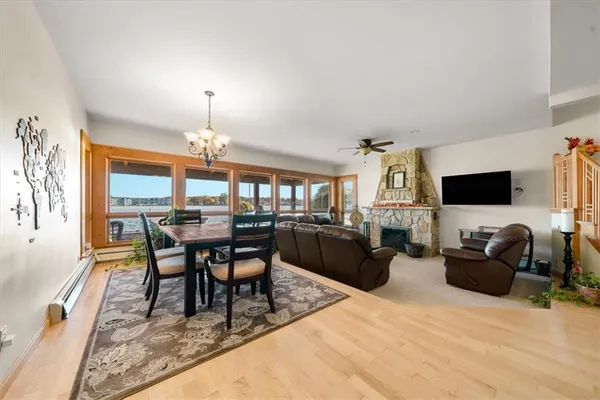 a living room with furniture a chandelier and a flat screen tv