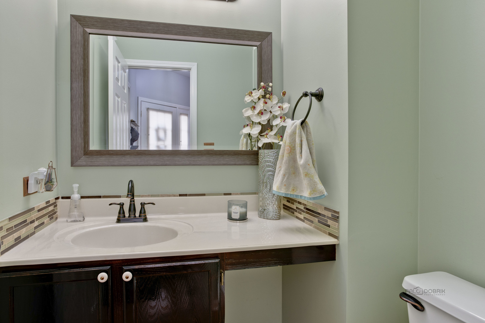 17898 Braewick Road Gurnee, IL 60031 - Photo 14 of 25 a bathroom with a sink and a mirror
