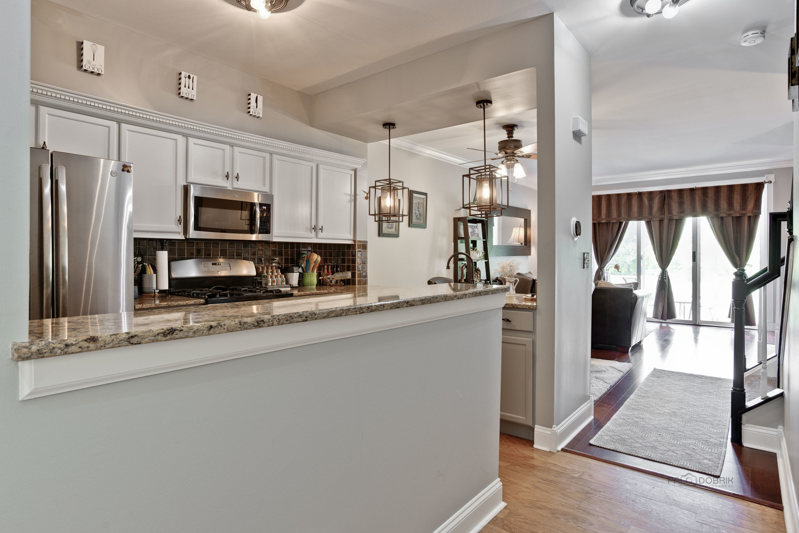 17898 Braewick Road Gurnee, IL 60031 - Photo 3 of 25 a kitchen with stainless steel appliances a refrigerator sink and microwave