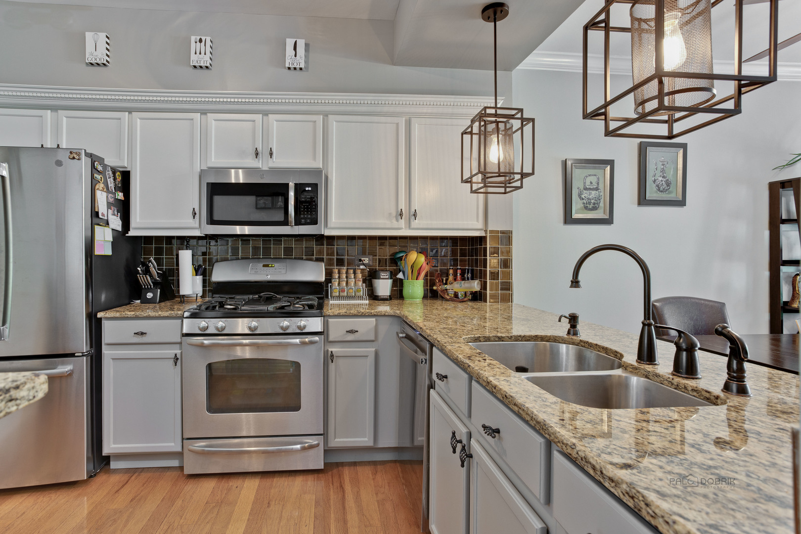 17898 Braewick Road Gurnee, IL 60031 - Photo 5 of 25 a kitchen with stainless steel appliances granite countertop a sink and a stove