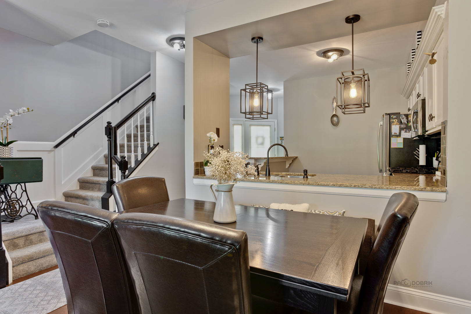 17898 Braewick Road Gurnee, IL 60031 - Photo 8 of 25 a kitchen with stainless steel appliances granite countertop a dining table chairs sink and cabinets
