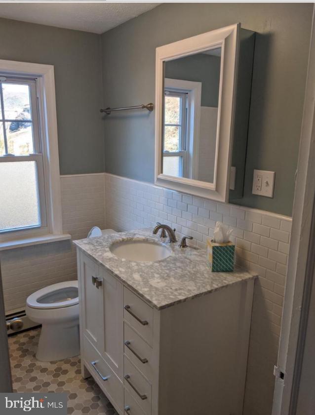 205 North Haddon Avenue Haddonfield, NJ 08033 - Photo 13 of 16 a bathroom with a granite countertop sink and a toilet
