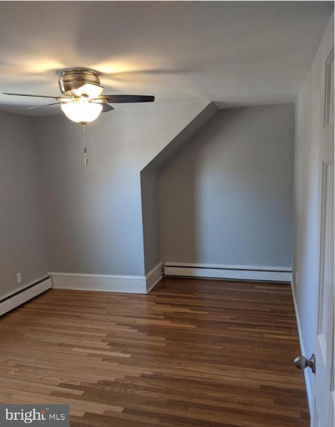 205 North Haddon Avenue Haddonfield, NJ 08033 - Photo 8 of 16 a view of an empty room with wooden floor and a window