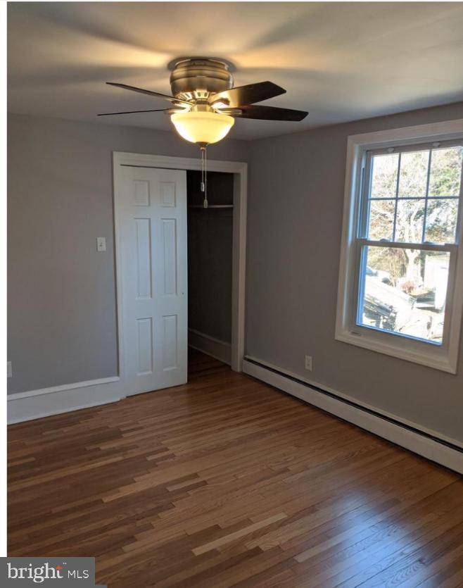 205 North Haddon Avenue Haddonfield, NJ 08033 - Photo 10 of 16 an empty room with wooden floor and windows