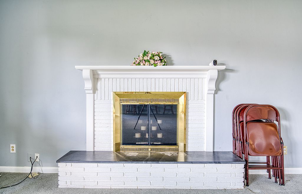 324 Beckenham Road Englewood, OH 45322 - Photo 6 of 26 This living area showcases a beautiful fireplace, perfect for cozy evenings.