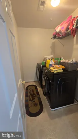 a living room with dining room and wooden floor