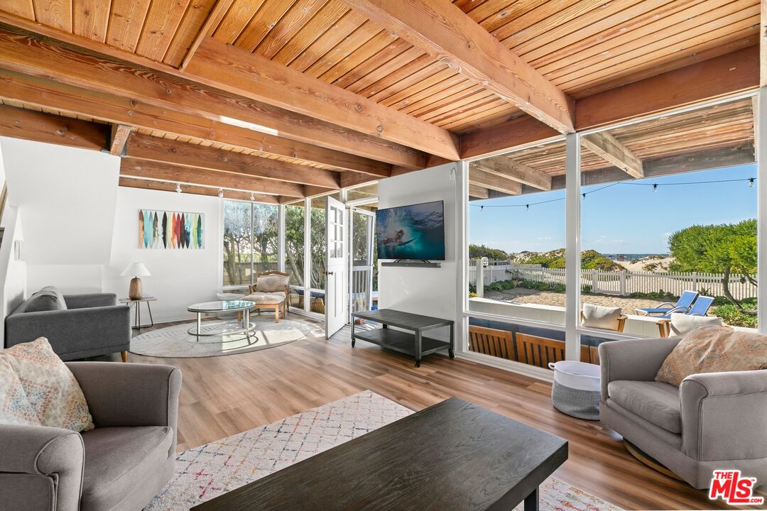 30800 Broad Beach Road Malibu, CA 90265 - Photo 11 of 28 a living room with furniture and a table
