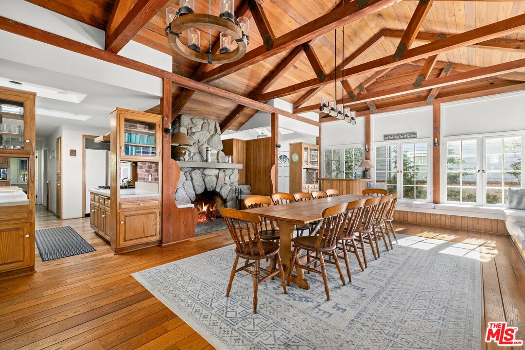 30800 Broad Beach Road Malibu, CA 90265 - Photo 17 of 28 a view of a dining room with furniture window and wooden floor
