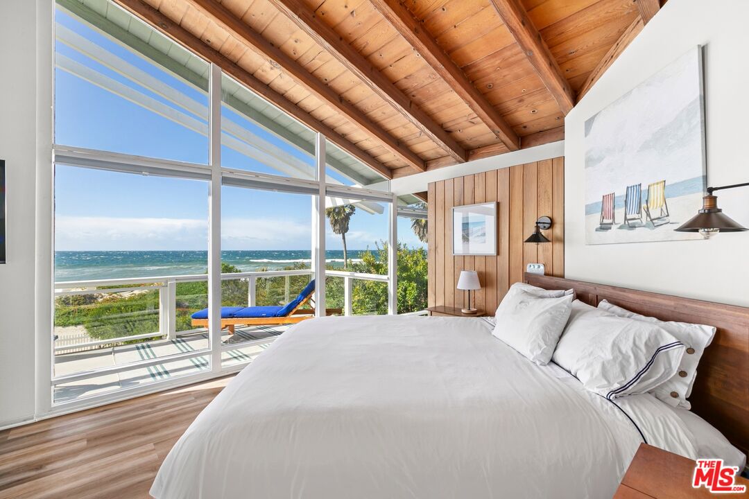 30800 Broad Beach Road Malibu, CA 90265 - Photo 22 of 28 a bed sitting in a bedroom next to a window
