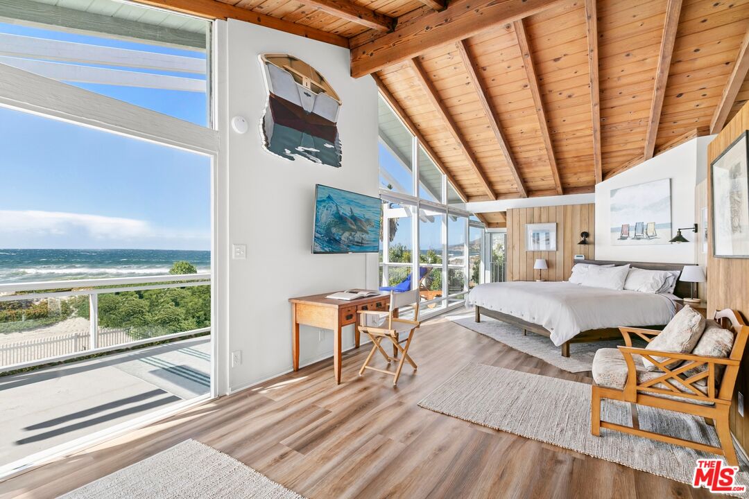 30800 Broad Beach Road Malibu, CA 90265 - Photo 6 of 28 a living room with furniture and a floor to ceiling window