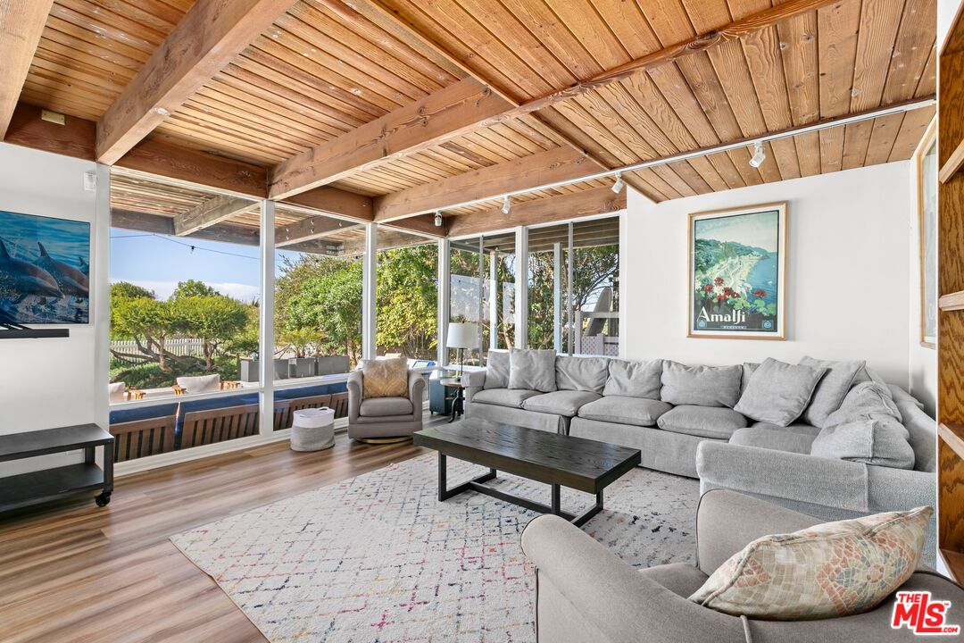 30800 Broad Beach Road Malibu, CA 90265 - Photo 10 of 28 a living room with furniture and a large window